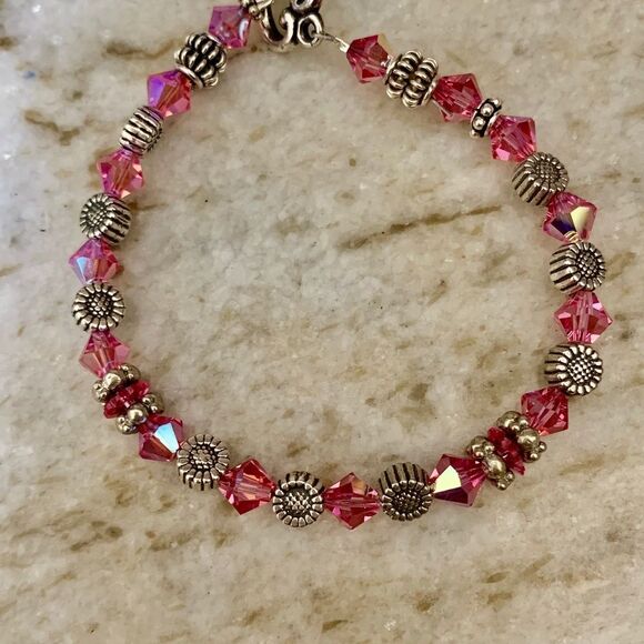 This handmade, one-of-a-kind, beautiful bracelet features 5  Pink Rose AB Crystals with Daisy Sterling Silver Bracelet #handmade